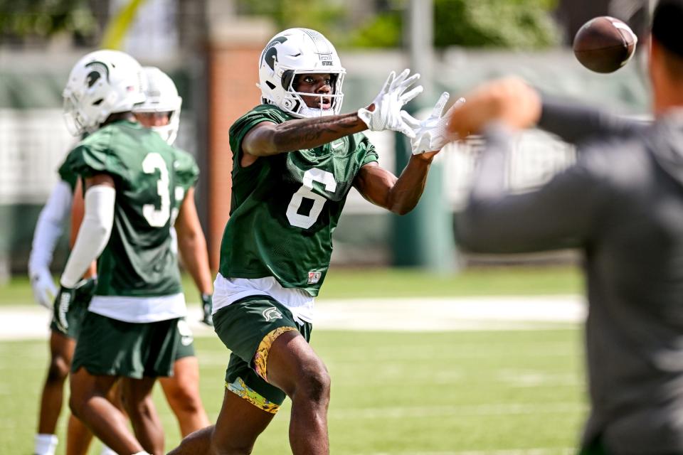 Michigan State's Nick Marsh catches a pass during the first day of football camp on Tuesday, July 30, 2024, in East Lansing.