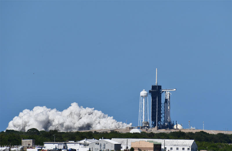 SpaceX test fired the first stage engines of the Falcon 9 rocket Friday that will boost astronauts Douglas Hurley and Robert Behnken into orbit Wednesday, weather permitting, for a flight to the International Space Station. / Credit: William Harwood/CBS News