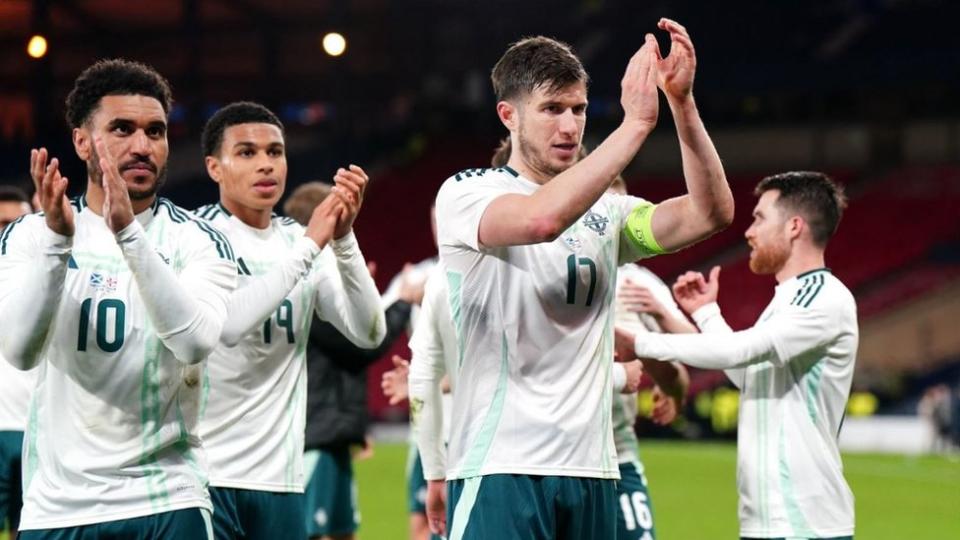 Northern Ireland's Paddy McNair (centre) and team-mates applaud the fans after the final whistle in a international friendly match at Hampden Park, Glasgow.