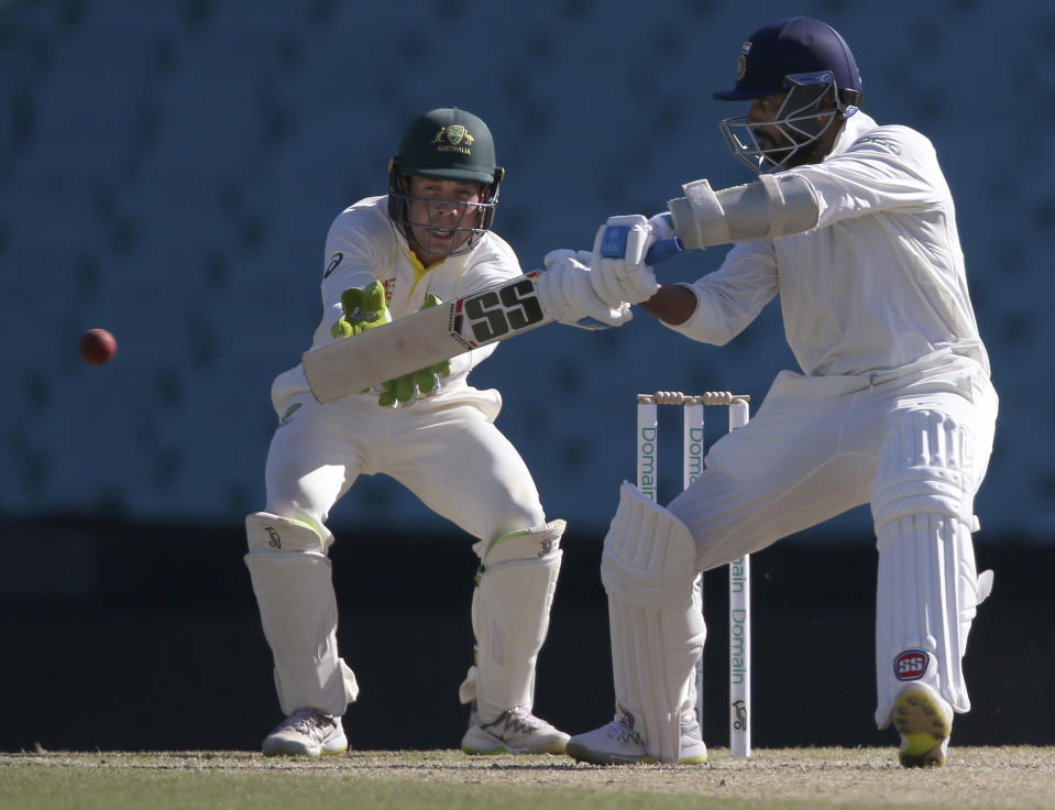 India's M. Vijay, right, bats in an over where he scores 26 runs during their tour cricket match against Cricket Australia XI in Sydney, Saturday, Dec. 1, 2018. (AP Photo/Rick Rycroft)