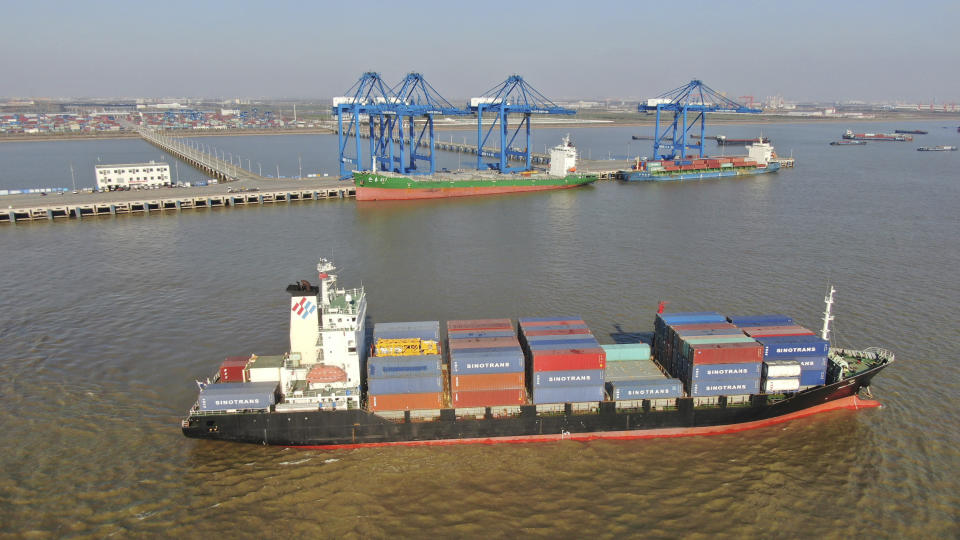 A container ship leaves a port in Nantong in eastern China's Jiangsu Province, Dec. 20, 2020. China's exports rose in 2020 despite pressure from the coronavirus pandemic and a tariff war with Washington, boosting its politically volatile trade surplus to $535 billion, one of the highest ever reported. (Chinatopix via AP)