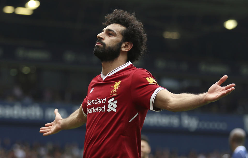 Liverpool’s Mohamed Salah celebrates tying the Premier League record for goals in a 38-game season in Liverpool’s 2-2 draw at West Brom. (AP)