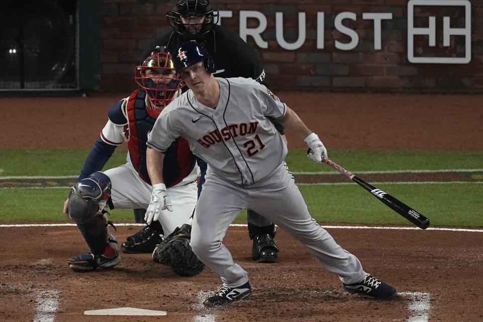 Houston Astros' Zack Greinke watches his single during the second inning in Game 4 of baseball's World Series between the Houston Astros and the Atlanta Braves Saturday, Oct. 30, 2021, in Atlanta. (AP Photo/John Bazemore)