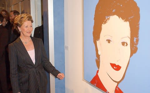 Queen Sonja in New York in 2005 alongside Andy Warhol’s portrait of her from 1982 - Credit: getty images