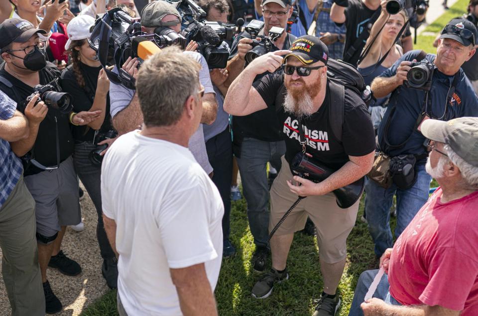 <span class="caption">Protesters and counter-protesters face off at a political rally in September 2021.</span> <span class="attribution"><a class="link " href="https://newsroom.ap.org/detail/CapitolBreachRally/fc4b8d42c3ff4e7eaa169719570a22c7/photo" rel="nofollow noopener" target="_blank" data-ylk="slk:AP Photo/Nathan Howard;elm:context_link;itc:0;sec:content-canvas">AP Photo/Nathan Howard</a></span>