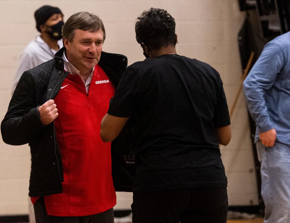 Georgia football head coach Kirby Smart talks with guests as Carver boys take on Lee at Carver High School in Montgomery, Ala., on Tuesday, Jan. 18, 2022.