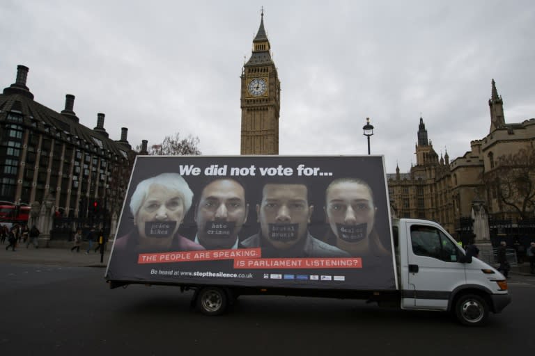 An advertising van with an anti-Brexit poster drives past the Houses of Parliament in central London on February 27, 2017