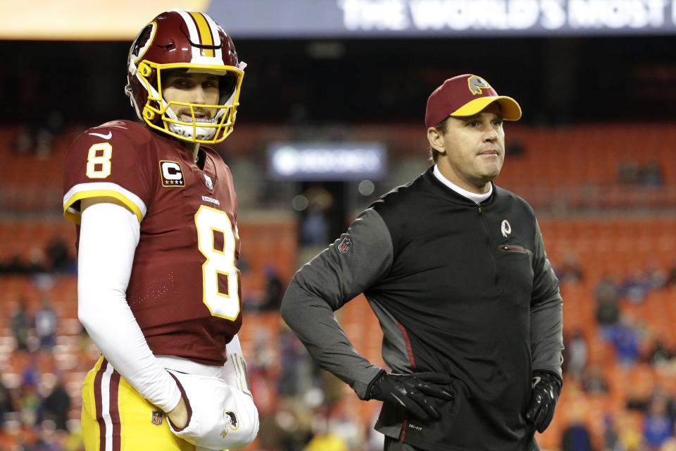 Former Redskins quarterback Kirk Cousins (8) and coach Jay Gruden before a game last season. (AP)