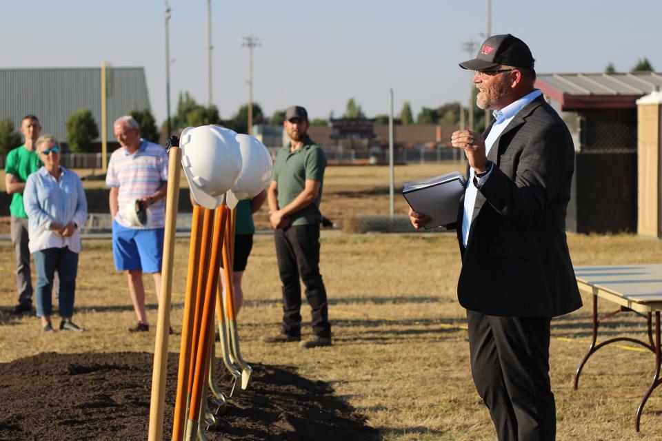 Bethel School District Superintendent Kraig Sproles introduces the new school project to staff, students and parents at Cascade Middle School's groundbreaking ceremony on Wednesday.