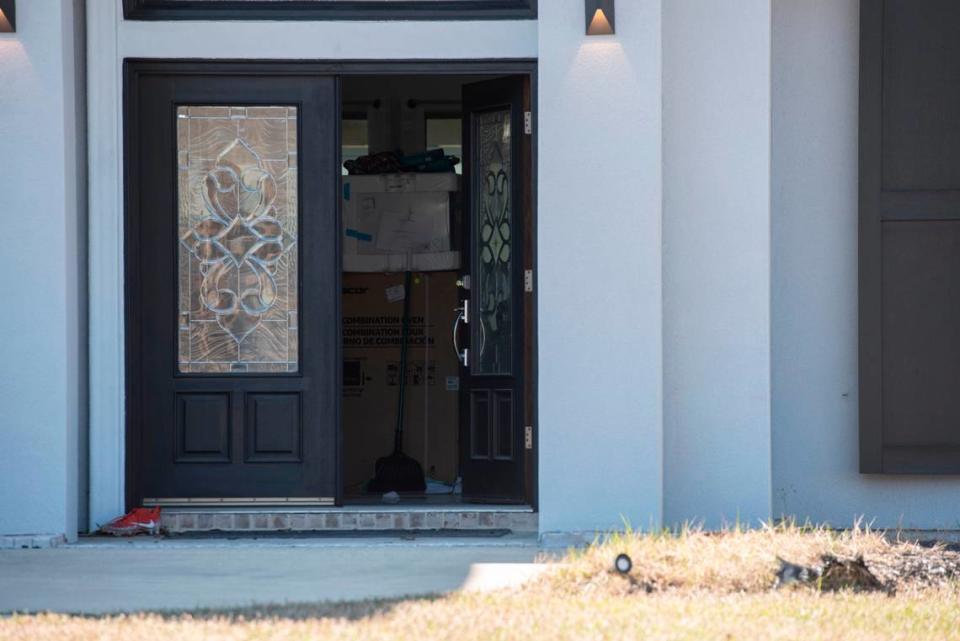 The front door of Biloxi Councilman Robert Deming’s house stands ajar as DEA agents conduct a raid on the home on Thursday, Jan. 26, 2023. Agents would not say specifically what they were looking for or what they found, but agents also conducted raids on several locations of The Candy Shop & Kratom, a kratom store chain owned by Deming. Hannah Ruhoff