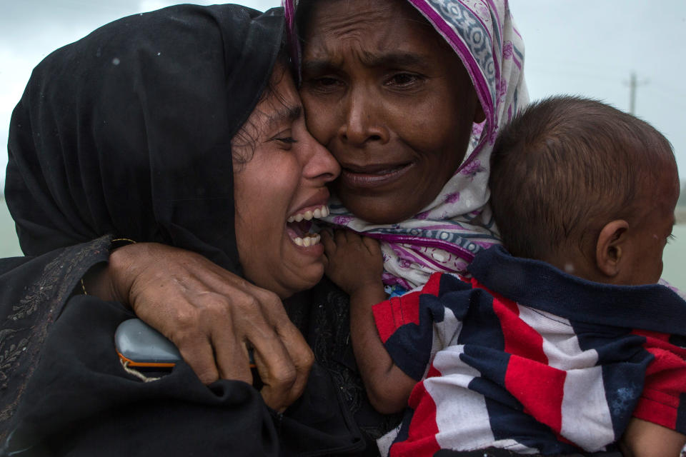 Rohingya Muslim refugees&nbsp;weep&nbsp;upon being reunited after arriving on a boat from Myanmar on Sept. 8 in Whaikhyang, Bangladesh.