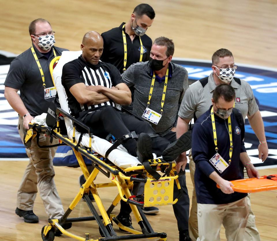 Official Bert Smith is rolled off the court on a stretcher after collapsing on the court during a game between Gonzaga and USC in the Elite Eight round of the 2021 NCAA Tournament on Tuesday, March 30, 2021, at Lucas Oil Stadium in Indianapolis, Ind.