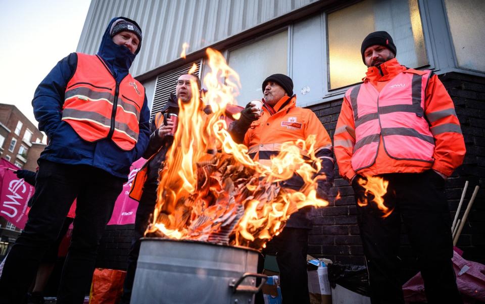 A group of striking postal workers in December - Leon Neal/Getty Images