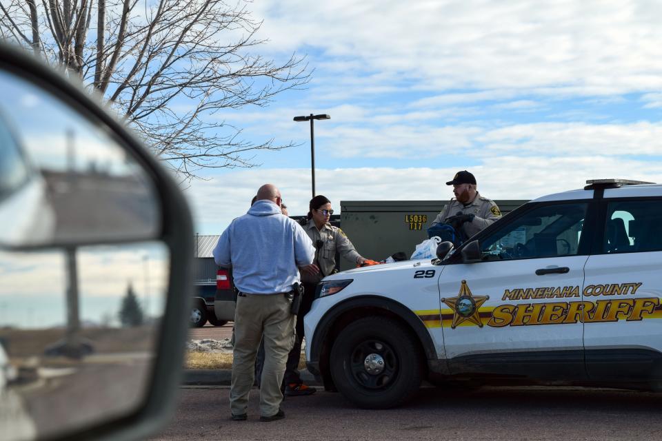 Minnehaha County Sheriff deputies conducting a search of an individual's belongings, before making an arrest, during a ride-along with the Argus Leader on Tuesday, March 1, 2022.