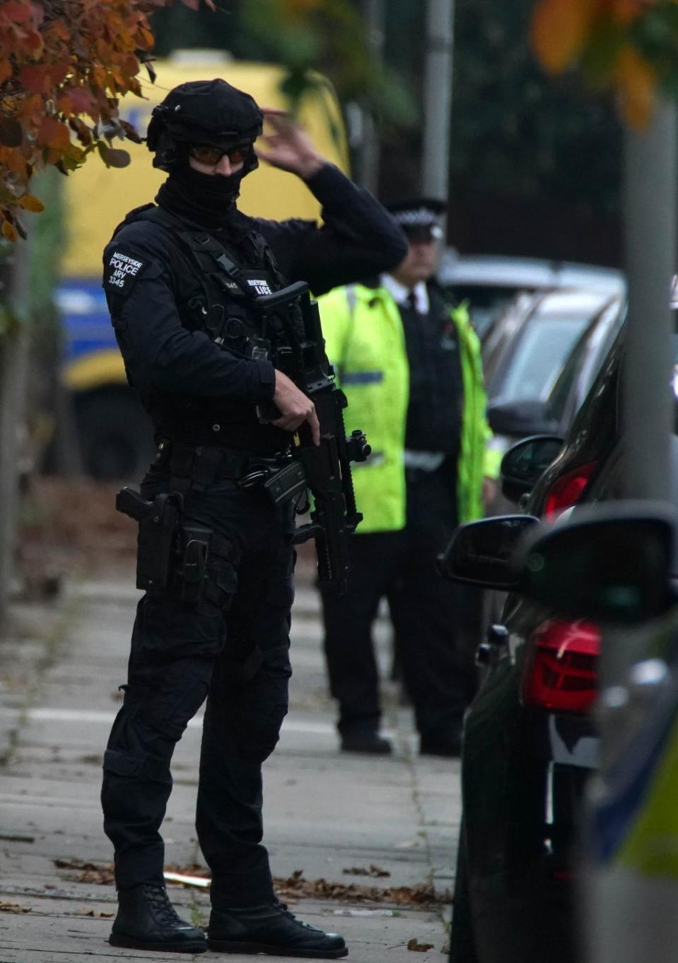 Armed police at an address in Liverpool (Peter Byrne/PA) (PA Wire)