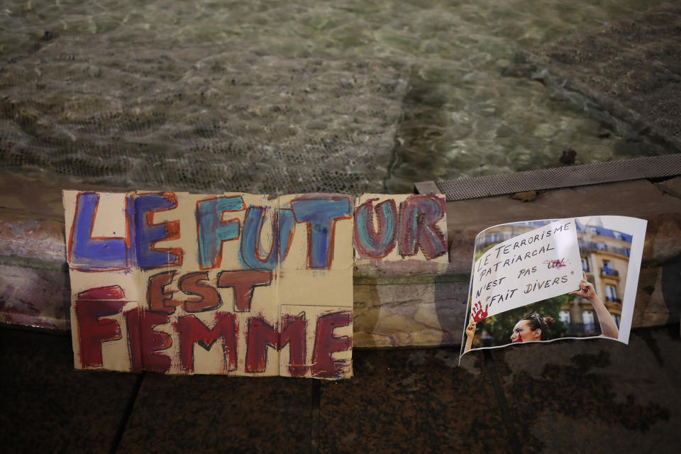 A poster reads "Futur is Women" during a demonstration Wednesday, Nov. 25, 2020 in Paris. With domestic violence on the rise amid the pandemic, activists are holding protests Wednesday from France to Turkey and world dignitaries are trying to find ways to protect millions of women killed or abused every year by their partners. (AP Photo/Francois Mori)