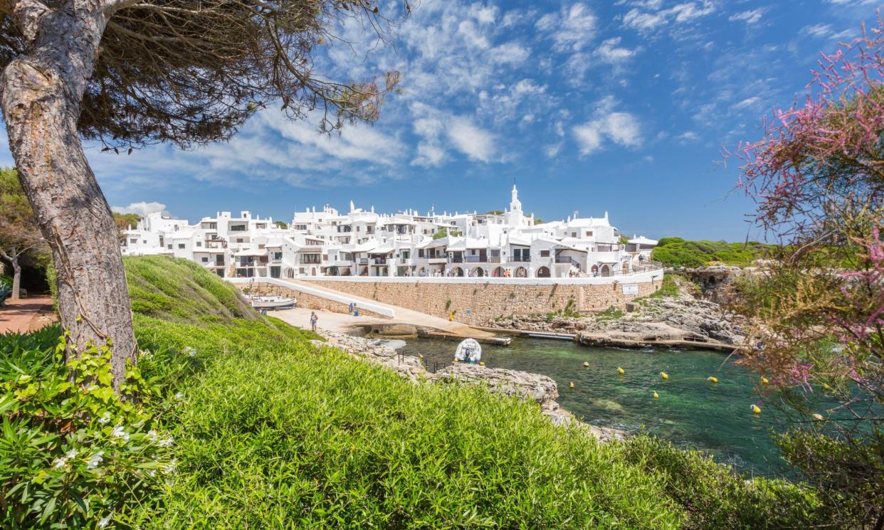 <span>Binibeca Vell, Menorca, is bracing for 1 million tourists this year. Residents have tighten the hours tourists can stop by.</span><span>Photograph: Joshua Windsor/Alamy</span>