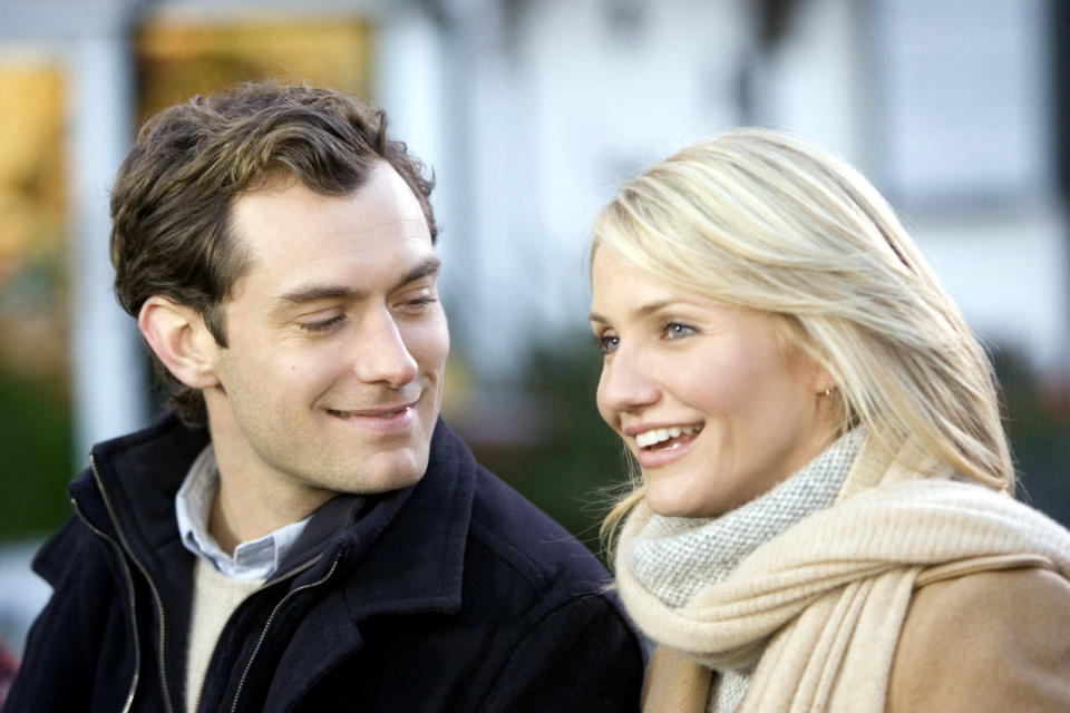 Jude Law smiling at Cameron Diaz.