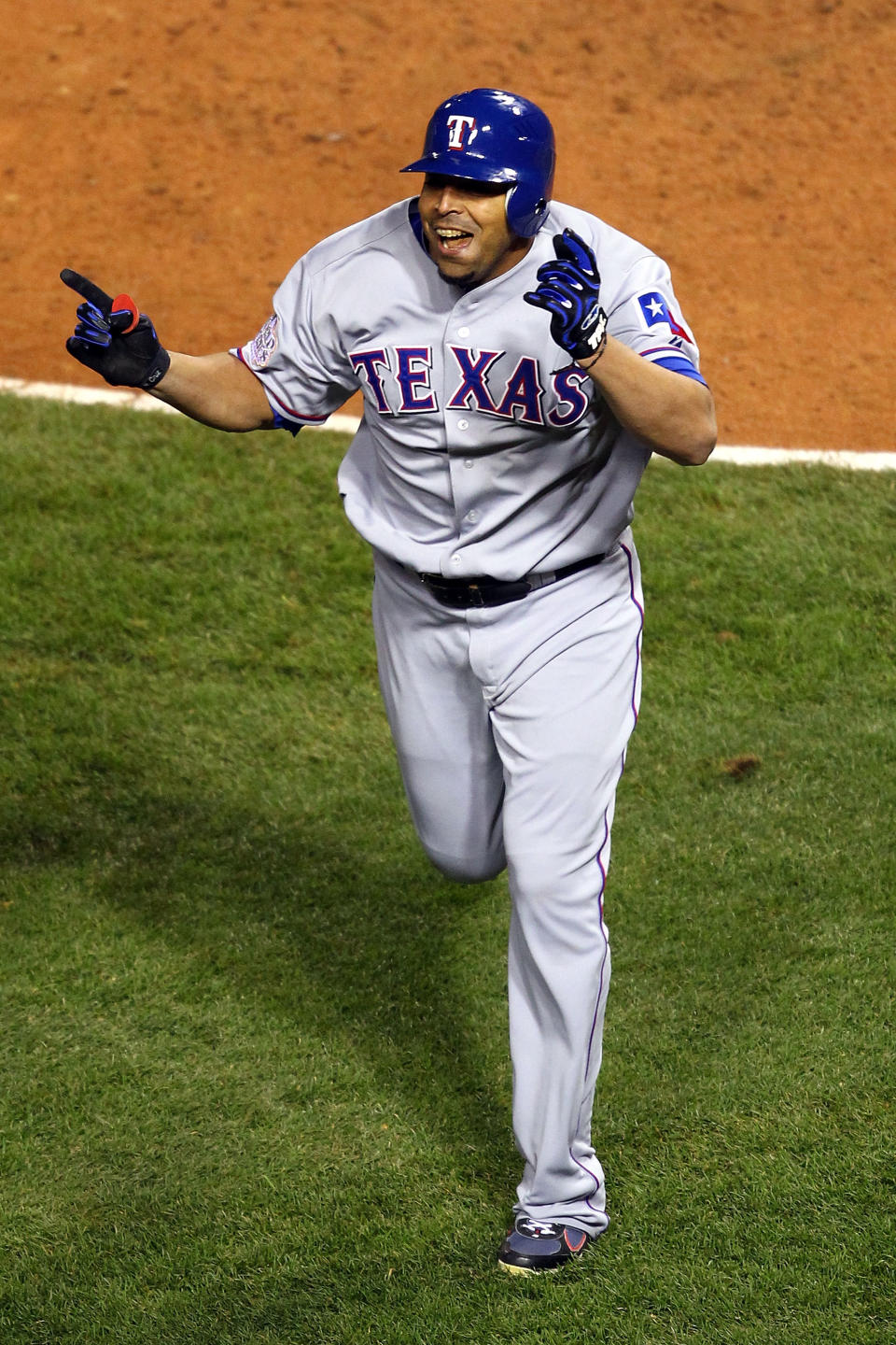 ST LOUIS, MO - OCTOBER 27: Nelson Cruz #17 of the Texas Rangers celebrates after hitting a solo home run in the seventh inning during Game Six of the MLB World Series against the St. Louis Cardinals at Busch Stadium on October 27, 2011 in St Louis, Missouri. (Photo by Dilip Vishwanat/Getty Images)