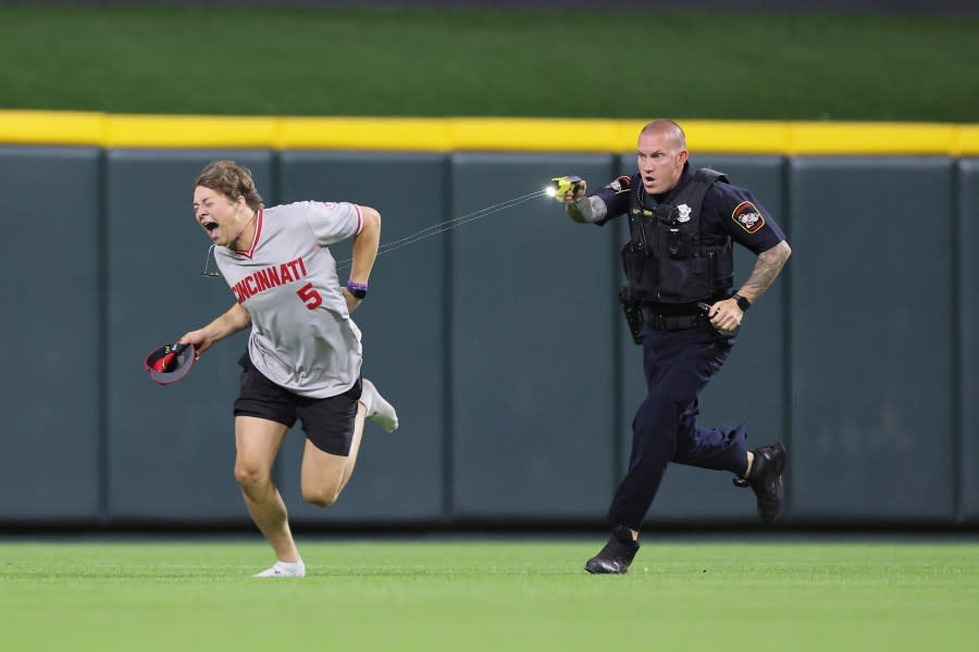 CINCINNATI, OHIO – JUNE 11: An unidentified fan is tased by a police officer as he runs on the field before the ninth inning of the Cincinnati Reds against Cleveland Guardians at Great American Ball Park on June 11, 2024 in Cincinnati, Ohio. (Photo by Andy Lyons/Getty Images)