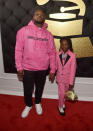 <p>Schoolboy Q’s daughter was twinning with Blue Ivy in their matching Gucci ensembles, but it was Joy Hanley’s blue flower accessory and gold pig purse that made her standout. (Photo: Getty Images) </p>
