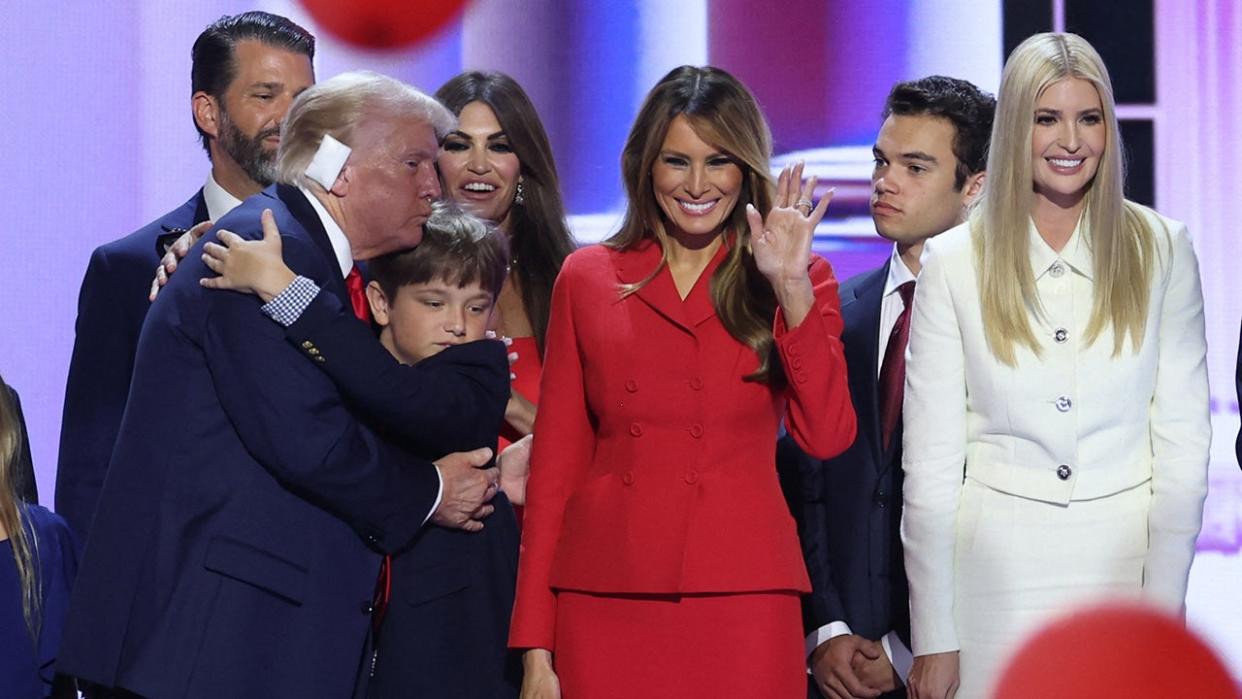 Republican presidential candidate former President Donald Trump, center, stands on stage with Melania Trump and other members of his family during the Republican National Convention