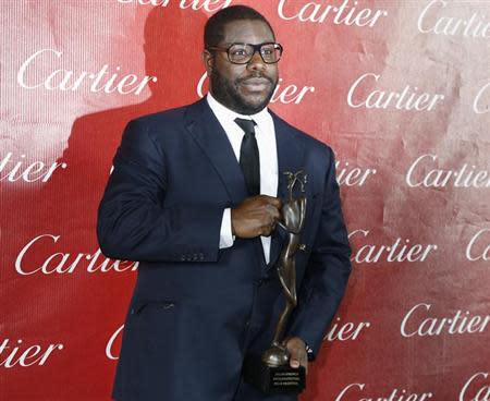 British film director Steve McQueen of the film "12 Years A Slave" poses after wining Director of the Year at the 2014 Palm Springs International Film Festival Awards Gala in Palm Springs, California January 4, 2014. REUTERS/Fred Prouser