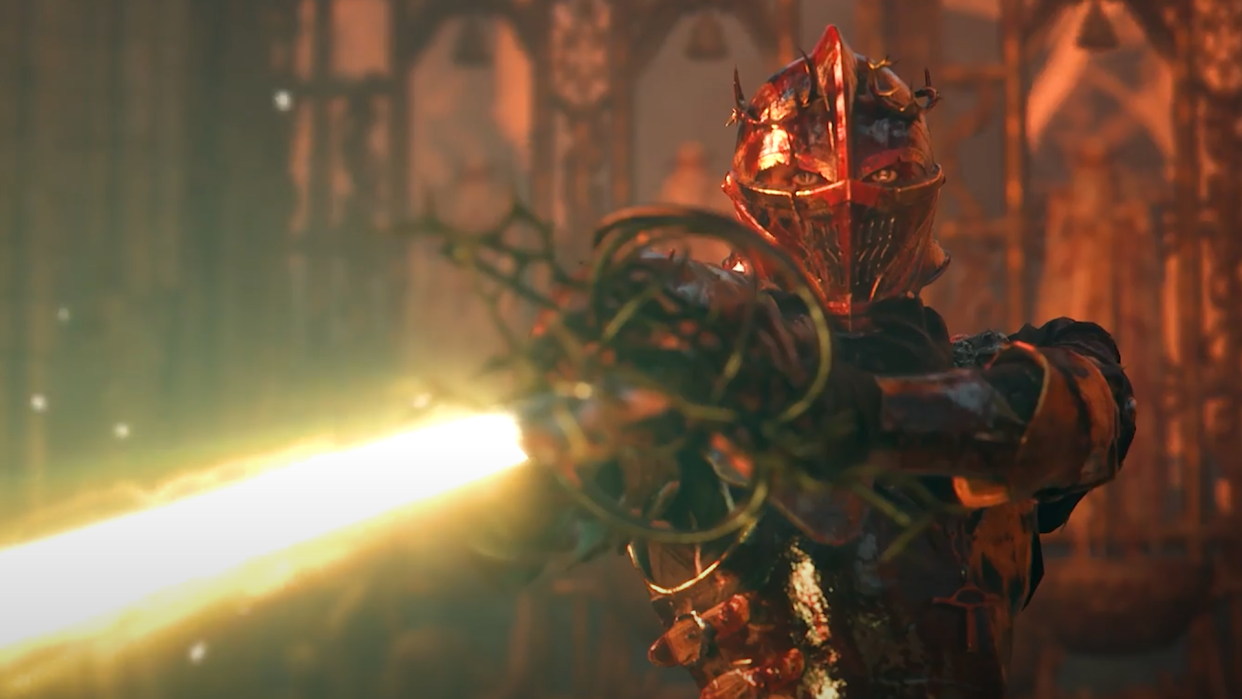  Pieta, a boss from the upcoming Lords of the Fallen game, levels a glowing blade menacingly at the player. 