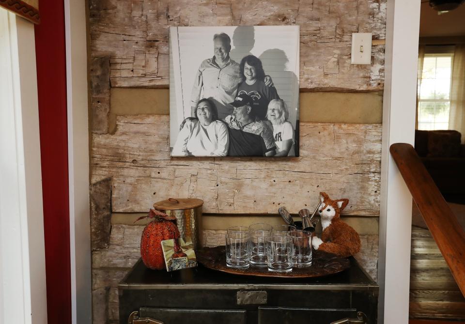 A photo of the Hutchins siblings hangs in the dining room of the Hutchins home built in 1780 in Bardstown, Ky. on Oct. 24, 2023. They gathered for the photo as they reunited after they all recovered from Covid in August of 2020.