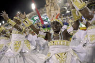 Performers from the Grande Rio samba school parade during Carnival celebrations at the Sambadrome in Rio de Janeiro, Brazil, Monday, Feb. 24, 2020. (AP Photo/Silvia Izquierdo)