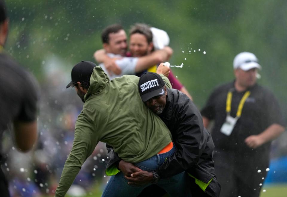 Adam Hadwin is wiped out by security at the Canadian Open (AP)