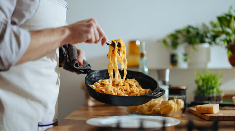 A chef cooking pasta
