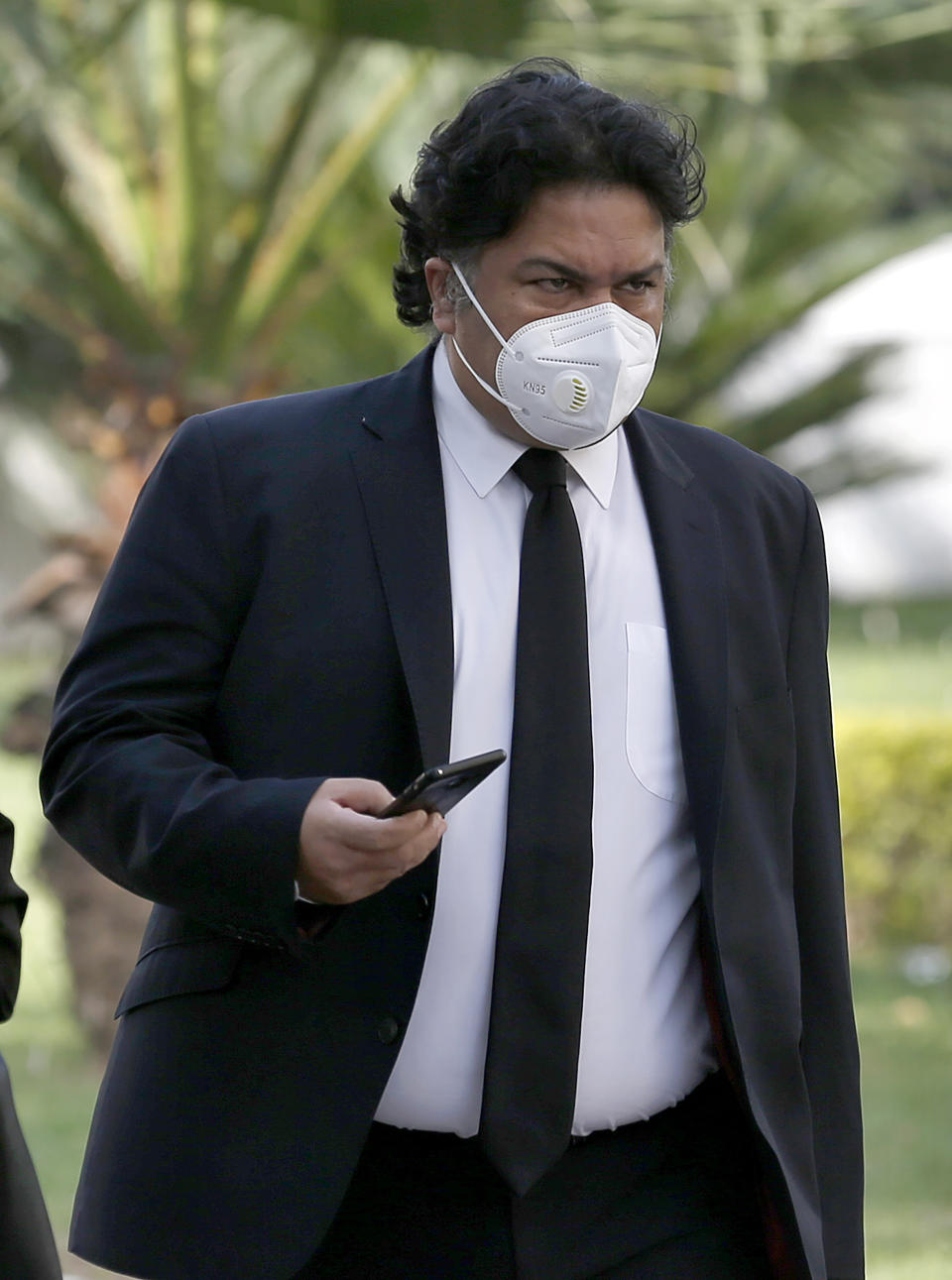 Faisal Siddiqi, a lawyer for the family of Daniel Pearl, an American reporter who was kidnapped and killed in Pakistan, arrives at the Supreme Court for an appeal hearing in the Pearl case, in Islamabad, Pakistan, Monday, Sept. 28, 2020. Pakistan's Supreme Court is to hear an appeal Monday by the family of Pearl that challenges the acquittal of a British-born Pakistani in the gruesome 2002 beheading of the Wall Street Journal reporter. (AP Photo/Anjum Naveed)