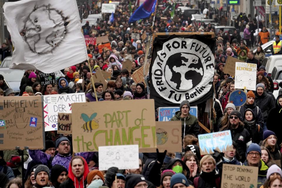 FILE - People take part in a 'Fridays For Future' protest rally in Berlin, Germany, Friday, March 3, 2023. A major new United Nations report being released Monday, March 20, 2023, is expected to provide a sobering reminder that time is running out if humanity wants to avoid passing a dangerous global warming threshold. (AP Photo/Michael Sohn, File)