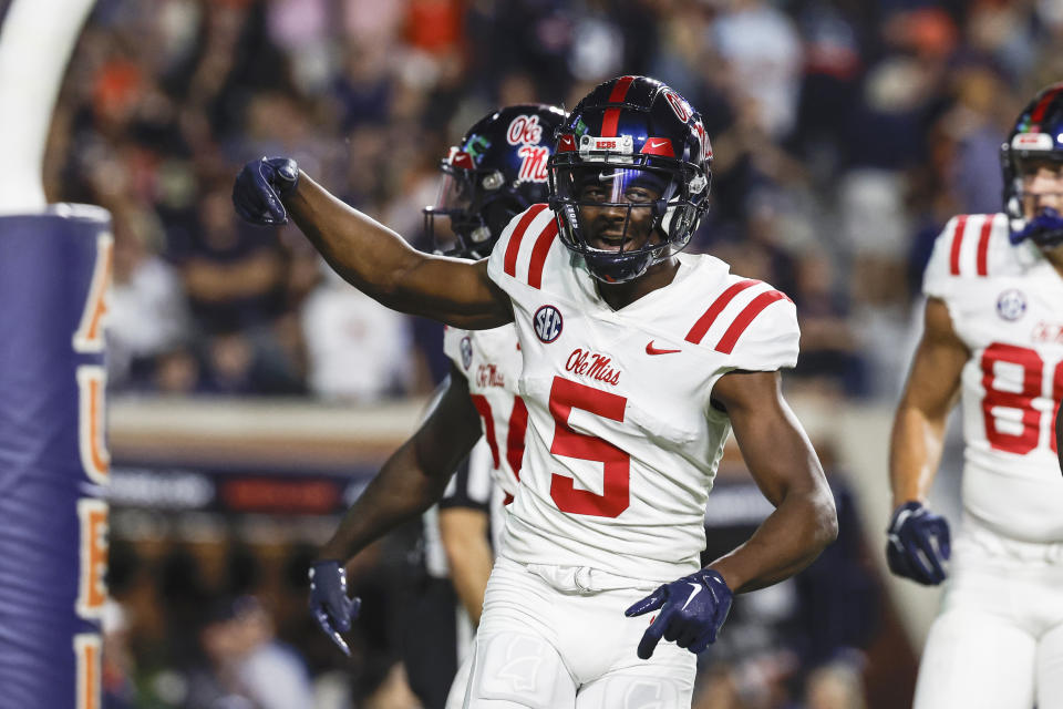 Mississippi wide receiver Zakhari Franklin (5) celebrates after scoring a touchdown against Auburn during the first half of an NCAA college football game, Saturday, Oct. 21, 2023, in Auburn, Ala. (AP Photo/ Butch Dill )