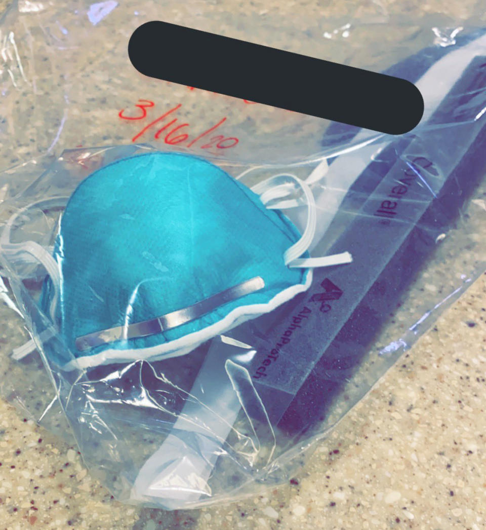A nurse in Illinois shared a photo of her N-95 mask she keeps in a bag labelled with her name. Many healthcare workers are being asked to ration their personal protective equipment. (via social media)