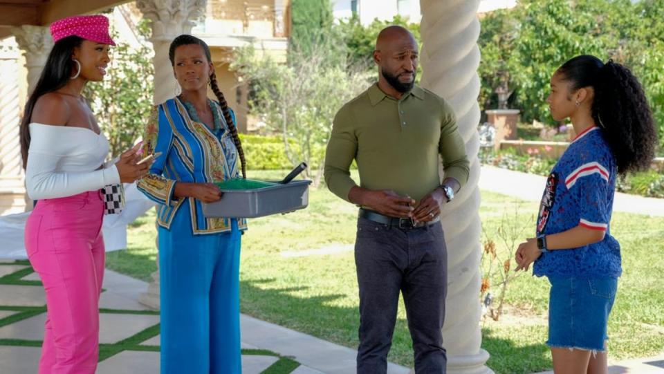 the banks family including ashley, vivian, phil, and hilary stand together outside in bel-air season two