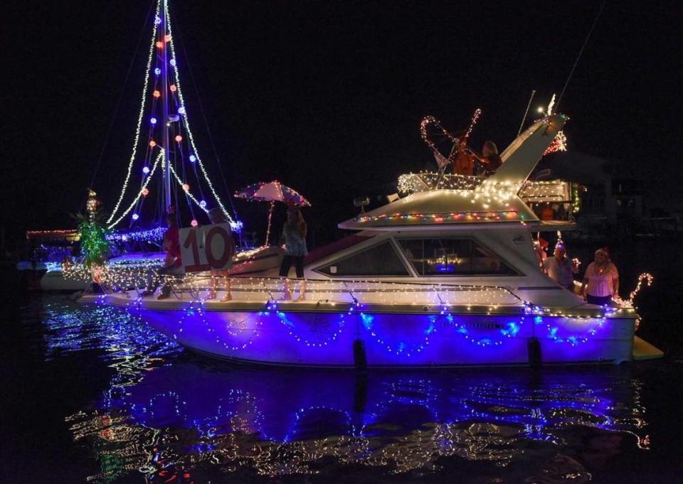Decorated boats sail through the waters near the Bradenton Yacht Club in Palmetto for the 18th year of the holiday boat parade on Manatee River in 2015.