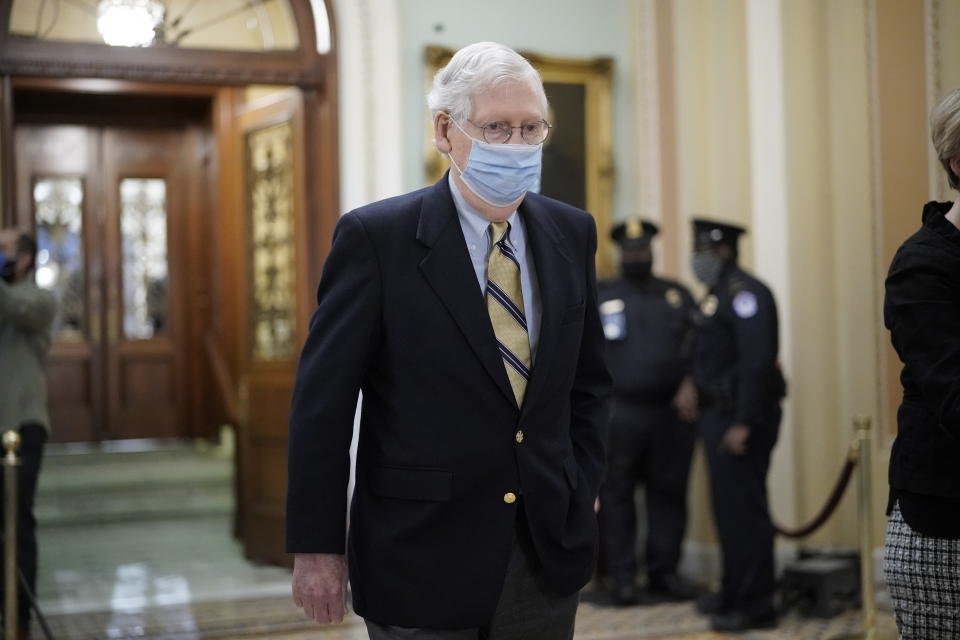 Senate Minority Leader Mitch McConnell of Kentucky, walks in the Capitol as the Senate convenes in a rare weekend session for final arguments in the second impeachment trial of former President Donald Trump, at the Capitol in Washington, Saturday, Feb. 13, 2021. (AP Photo/J. Scott Applewhite)