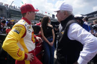 Josef Newgarden, left, talks with Roger Penske during qualifications for the Indianapolis 500 auto race at Indianapolis Motor Speedway, Saturday, May 18, 2024, in Indianapolis. (AP Photo/Darron Cummings)