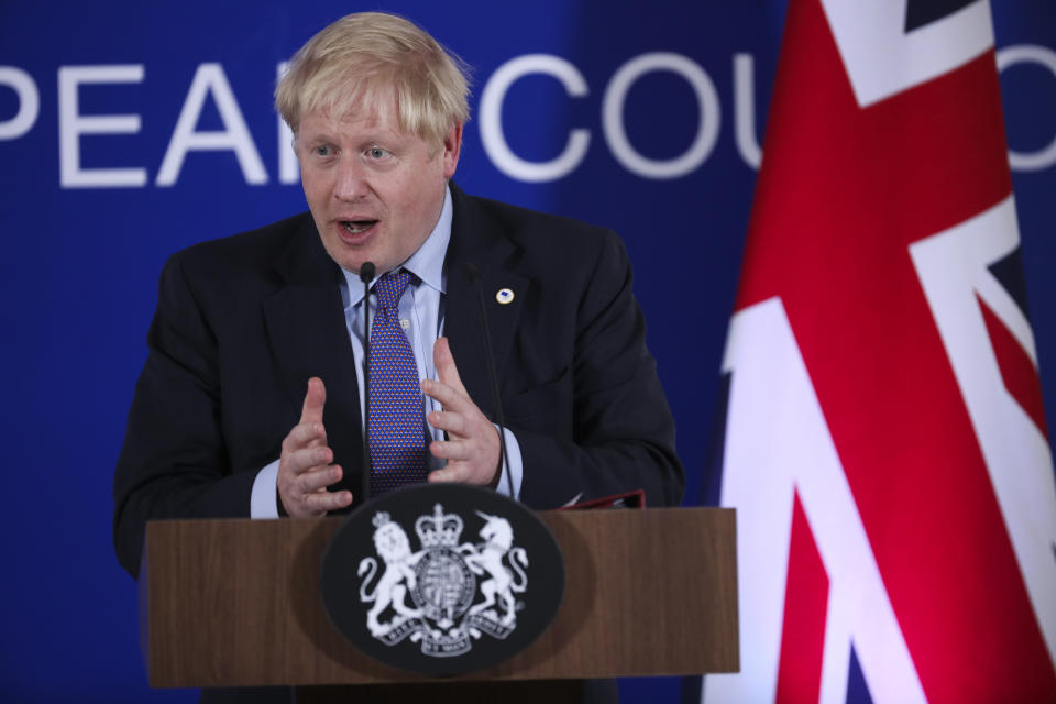 British Prime Minister Boris Johnson answers questions during a media conference at an EU summit in Brussels, Thursday, Oct. 17, 2019. Britain and the European Union reached a new tentative Brexit deal on Thursday, hoping to finally escape the acrimony, divisions and frustration of their three-year divorce battle. (AP Photo/Francisco Seco)