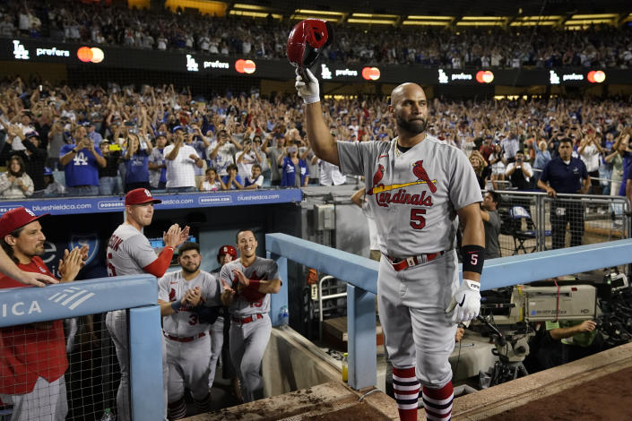 St. Louis Cardinals designated hitter Albert Pujols (5) celebrates after hitting a home run during the fourth inning of a baseball game against the Los Angeles Dodgers in Los Angeles, Friday, Sept. 23, 2022. Brendan Donovan and Tommy Edman also scored. It was Pujols' 700th career home run. (AP Photo/Ashley Landis)