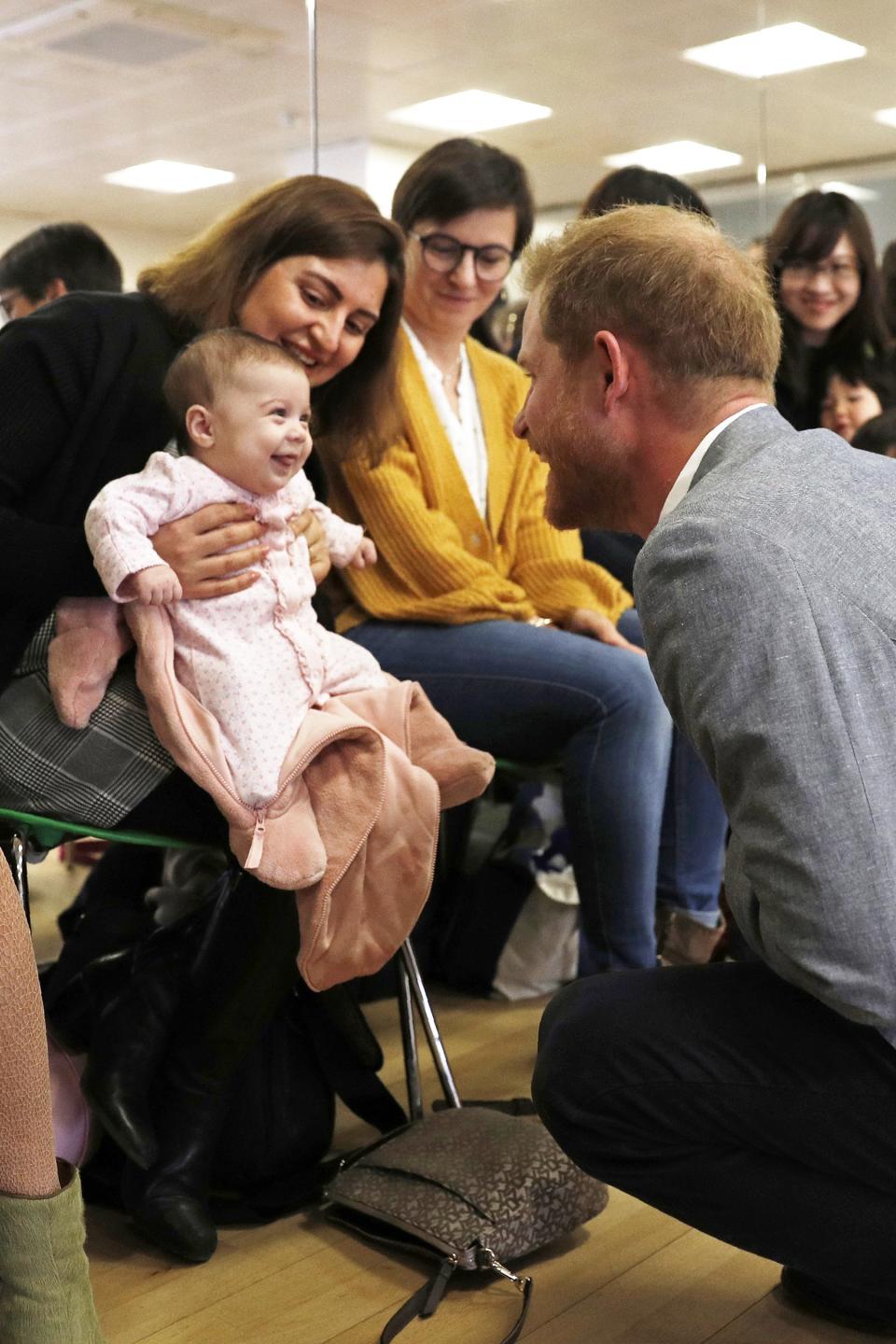 During a solo visit to a YMCA in west London in early April, Harry <strong><a rel="nofollow noopener" href="https://people.com/royals/prince-harry-makes-baby-smile-ballet-ymca-visit/" target="_blank" data-ylk="slk:charmed a smiling baby;elm:context_link;itc:0;sec:content-canvas" class="link ">charmed a smiling baby</a></strong> and couldn't resist exchanging a few silly faces. He told her mother, "I love that face." When asked about the interaction, the baby's mom said said, "I think he has babies on his mind."