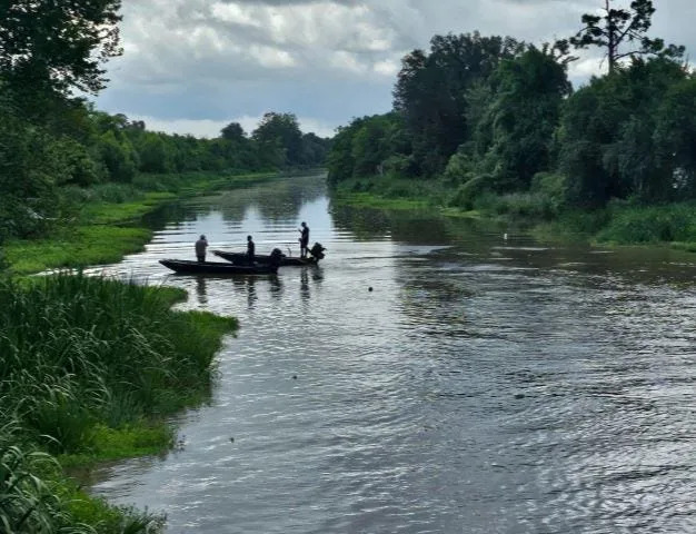 Crews examine an oil spill in Bayou Lafourche.