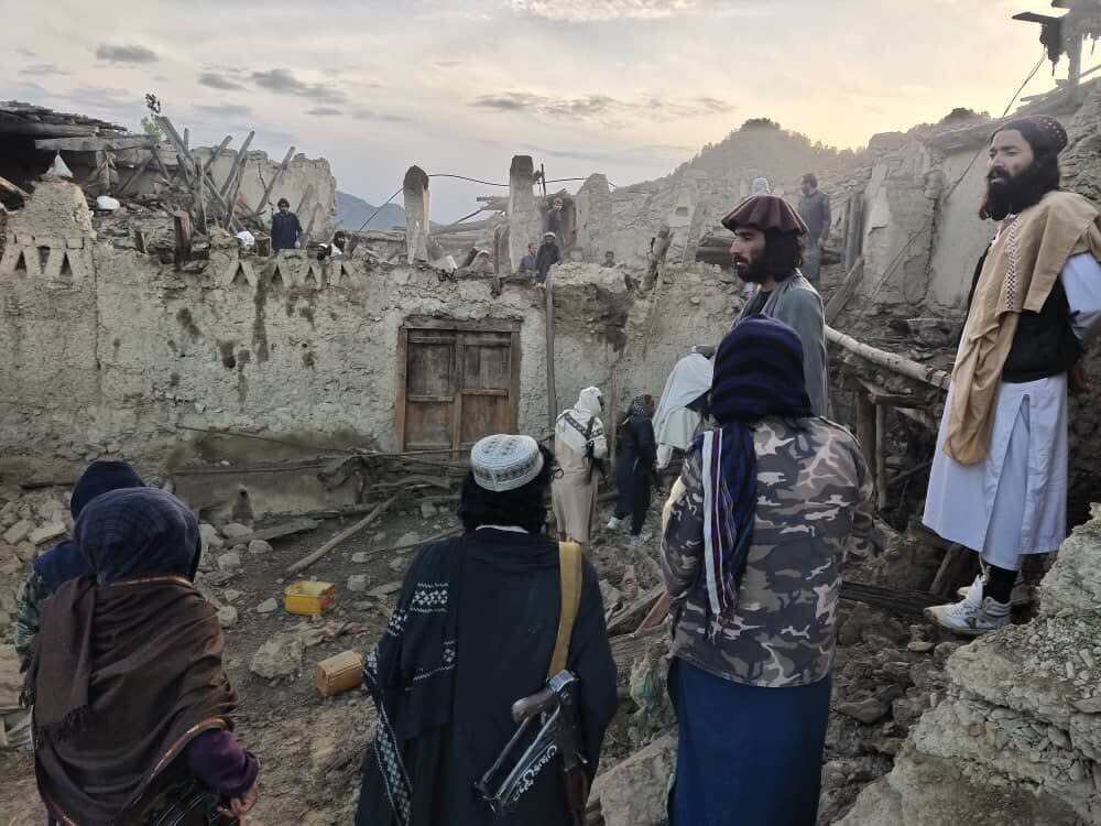 Afghans look at destruction caused by an earthquake in the province of Paktika, eastern Afghanistan, Wednesday, June 22, 2022. (Bakhtar News Agency via AP)