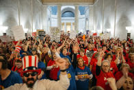 <p>Striking school workers hold signs and chant inside the West Virginia Capitol in Charleston, W.Va., on Friday, March 2, 2018. A week ago, thousands of public school teachers in West Virginia went out on strike, a rare but familiar union-organized action to protest low wages and rising health-care costs. Tuesday night, state union leaders and the Governor Jim Justice reached a deal, and the teachers were expected to be back at work on Thursday, but they didn’t go. Unsatisfied with the resolution, they stayed on the picket line, mounting one of the country’s biggest unauthorized “wildcat” strikes in decades. (Photo: Scott Heins/Bloomberg via Getty Images) </p>