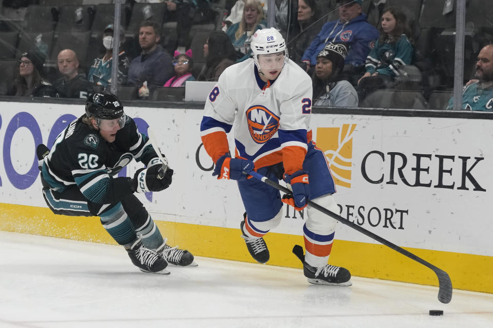 New York Islanders defenseman Alexander Romanov (28) skates with the puck against San Jose Sharks left wing Fabian Zetterlund (20) during the first period of an NHL hockey game in San Jose, Calif., Thursday, March 7, 2024. (AP Photo/Jeff Chiu)