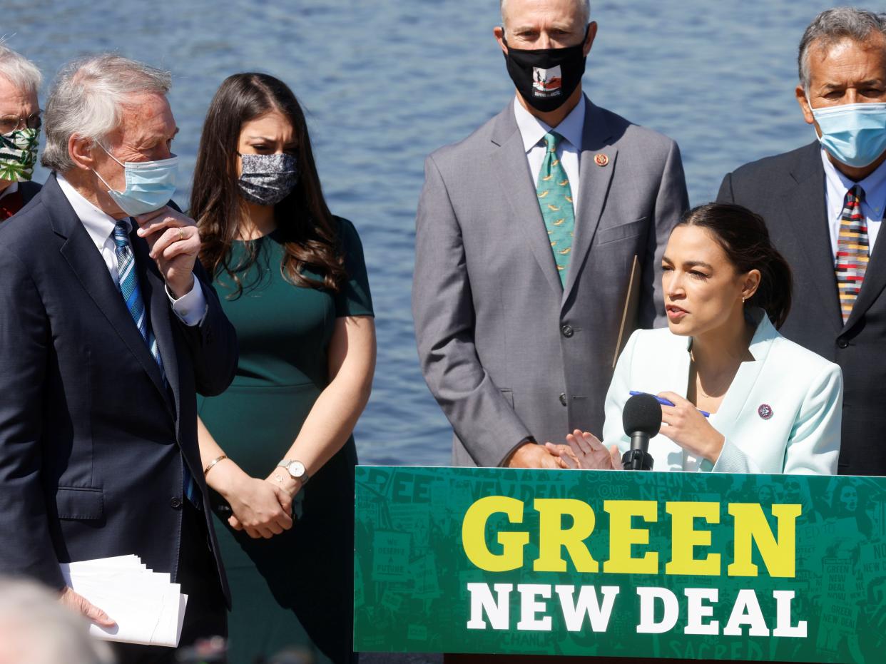 <p>US Rep Alexandria Ocasio-Cortez speaks as she and fellow Democratic lawmakers relaunch their ‘Green New Deal’ resolution on Capitol Hill in Washington, US, 20 April, 2021</p> (REUTERS)