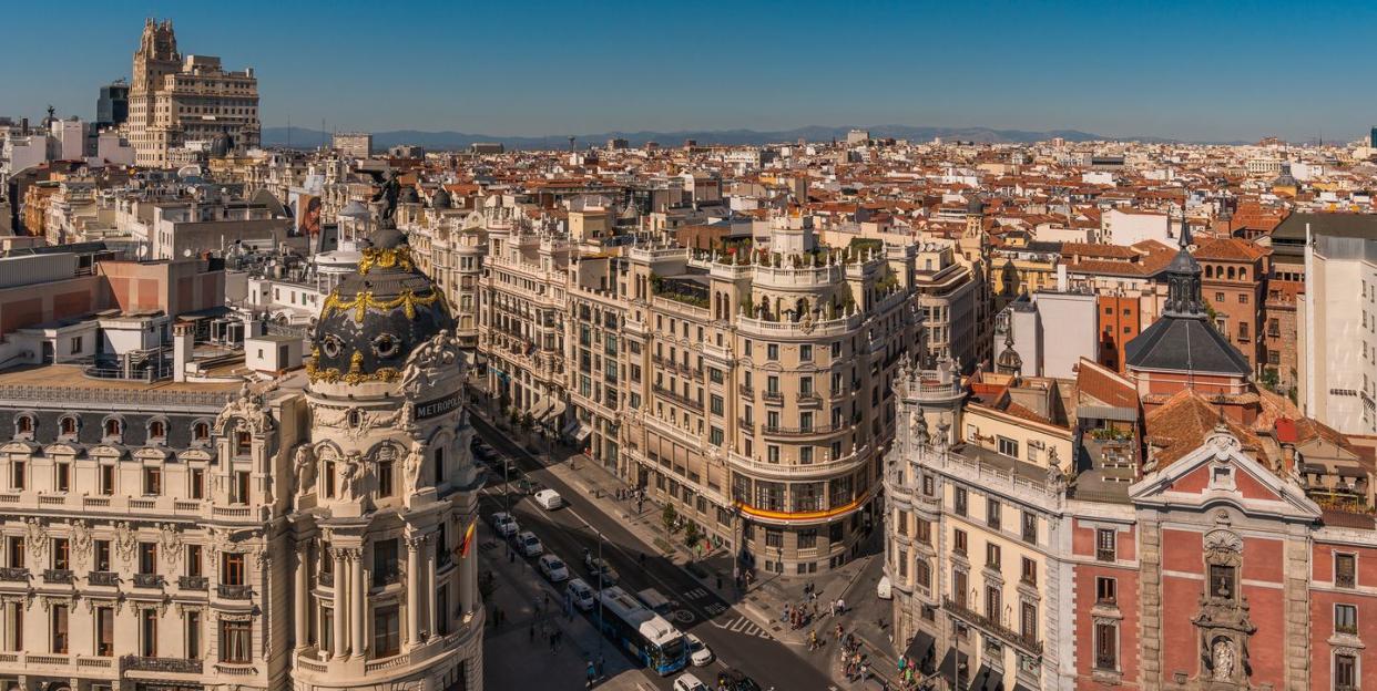 downtown madrid, spain, where the calle de alcala meets the gran via these are two of the most famous and busy streets in madrid