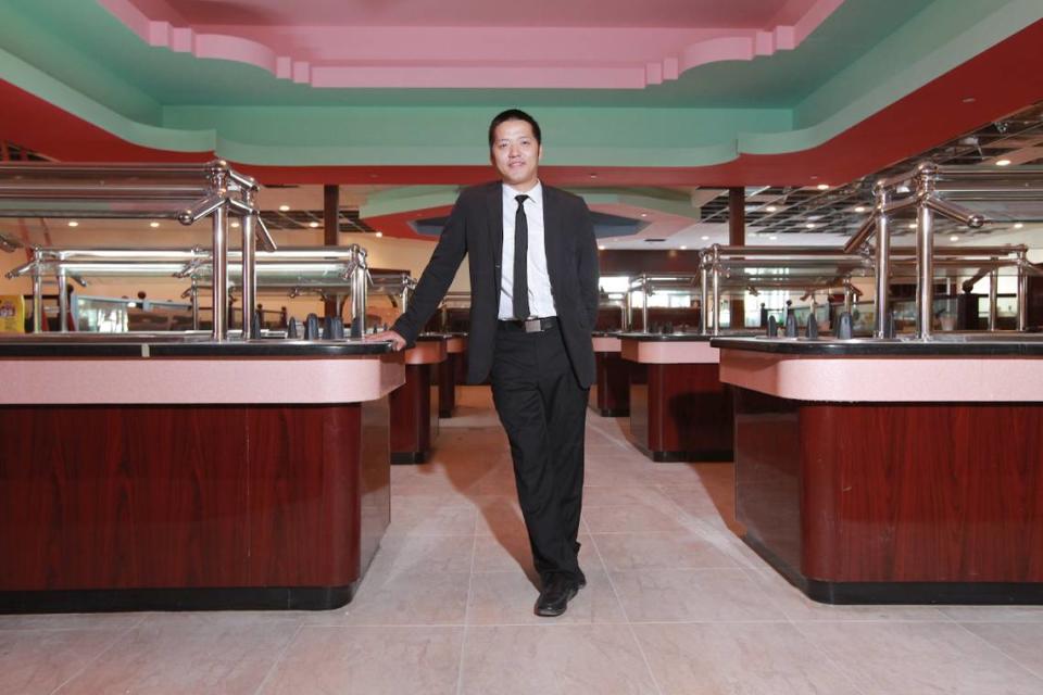 Eddie Pan, a partner in the Hibachi Grill when it opened in 2011, stands in the serving area of buffet-style restaurant.